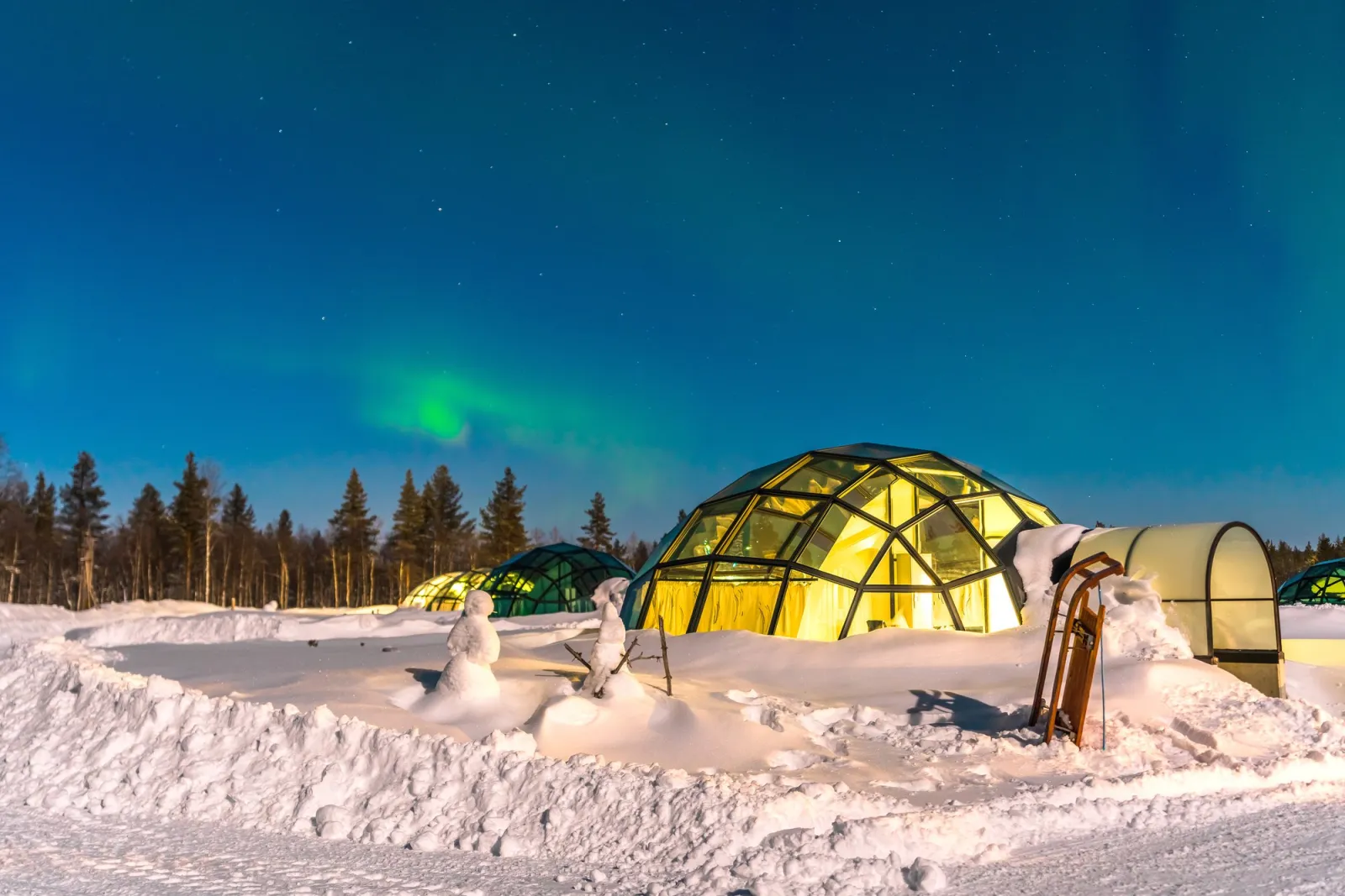 Snuggle Up, Snowmobiles and Northern Lights